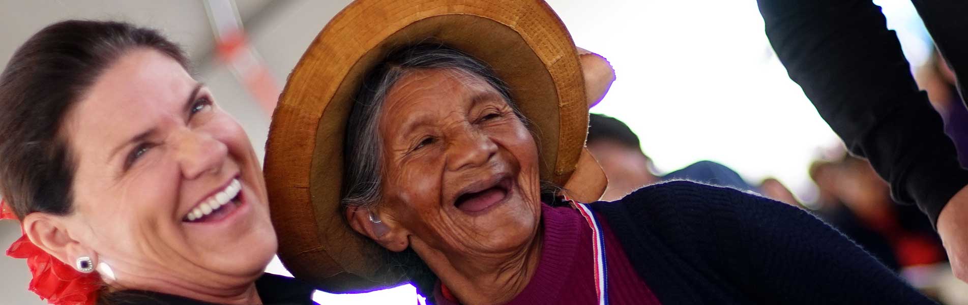 Happy older hearing aid recipient woman