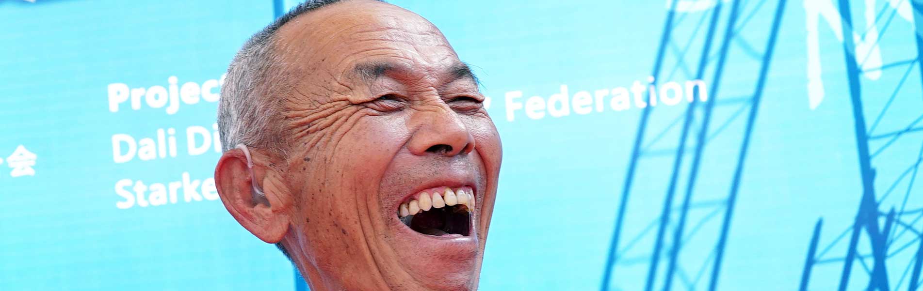 older man in China very happy to hear again