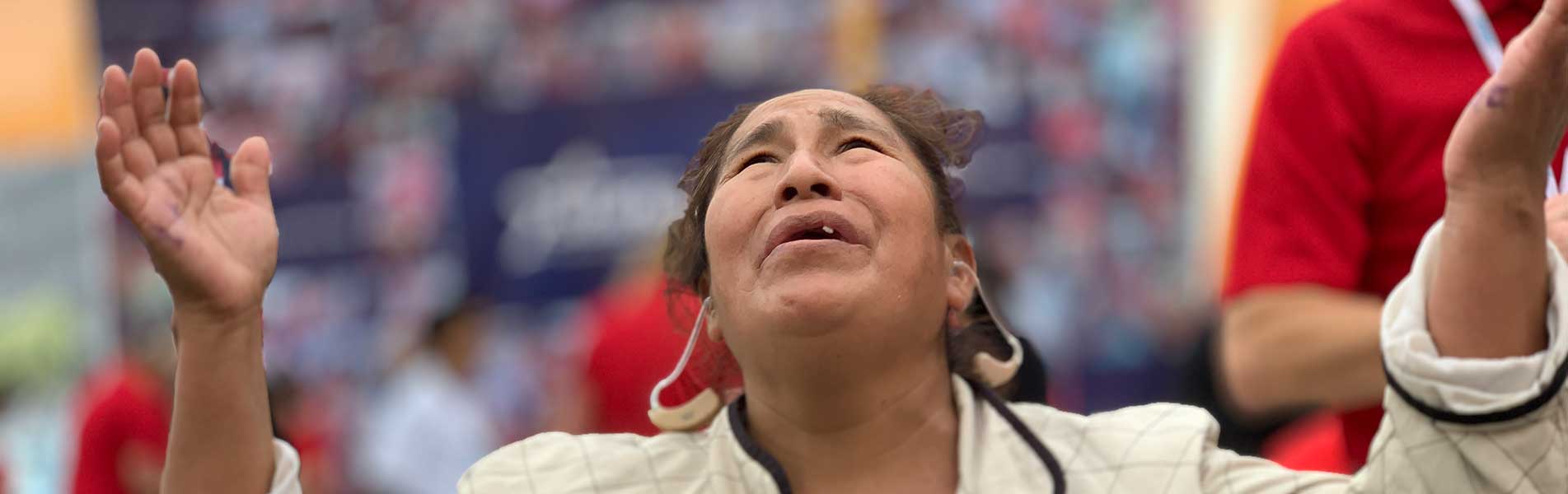 happy woman with a hearing aid