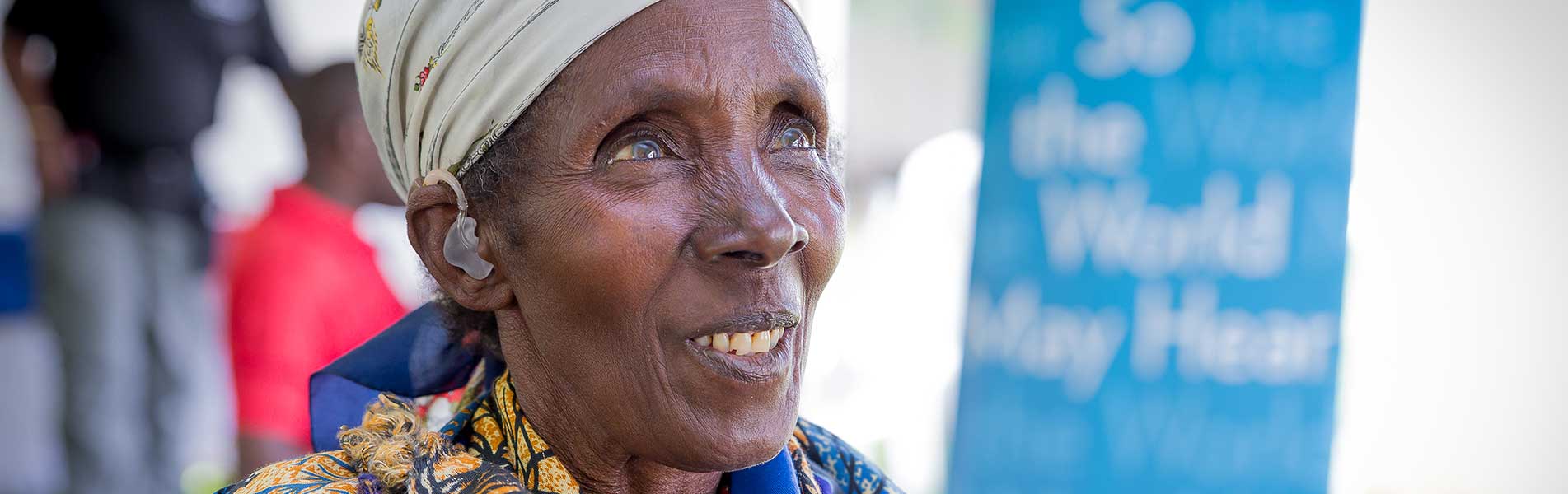 Older woman happy to have hearing aids