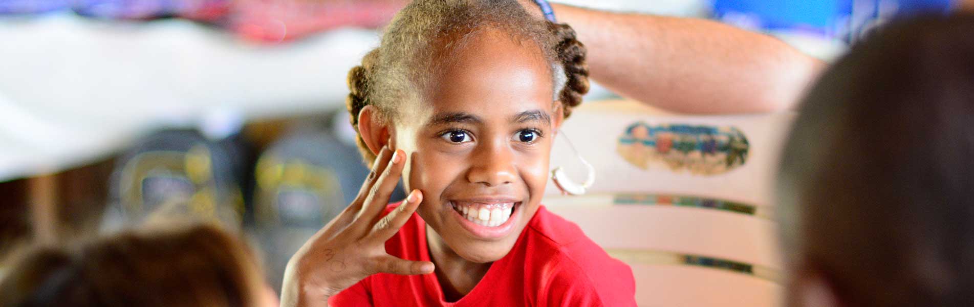 happy girl with a hearing aid