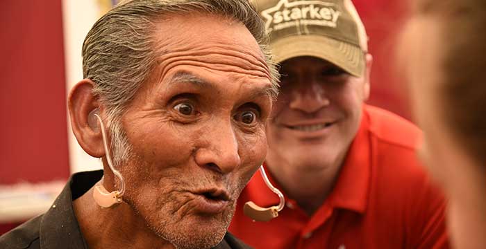 Older man very happy to have hear again with the hearing aids