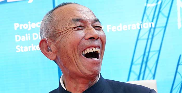 older man in China very happy to hear again