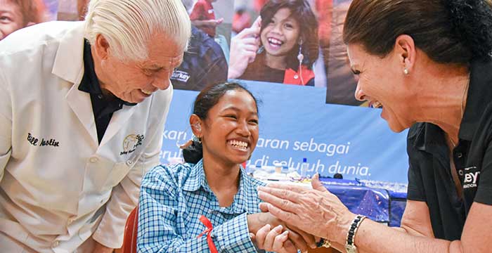 Bill and Tani with a hearing aid participant