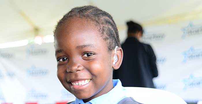 young child with hearing aids in Zambia