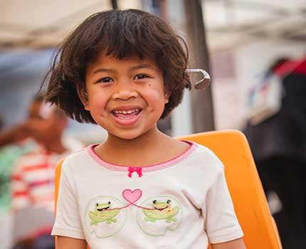 Little girl happy with hearing aids